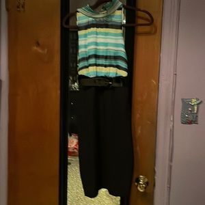 Nice to wear for dinner or the office. Multi color on top with a ruffed neck